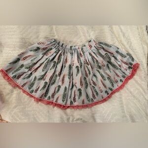 CARMEN TABERNER skirt with feather print lace and pompom hem twirl
